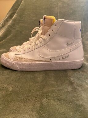 Nike White High-Top Sneakers with Yellow Tongue and Silver Swooshes